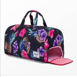 Herschel black and pineapple print duffel bag